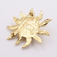 Broche soleil Yves Saint-Laurent